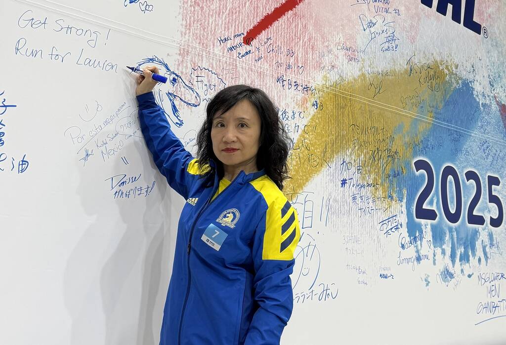 Professor Holly Wang "Runs for Lauren" in Tokyo Marathon 6 Dr. Holly Wang participating in 2025 Tokyo Marathon, and running for Lauren. Writing on large wall "Run for Lauren"
